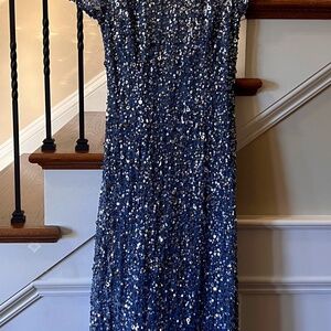 Sequin gown 

Colour is Blue Nile

PRODUCT LENGTH:
68.00" Top of shoulder to hem